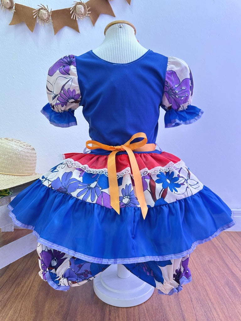 Disfraz infantil de junio con flores de colores azules y rojas 