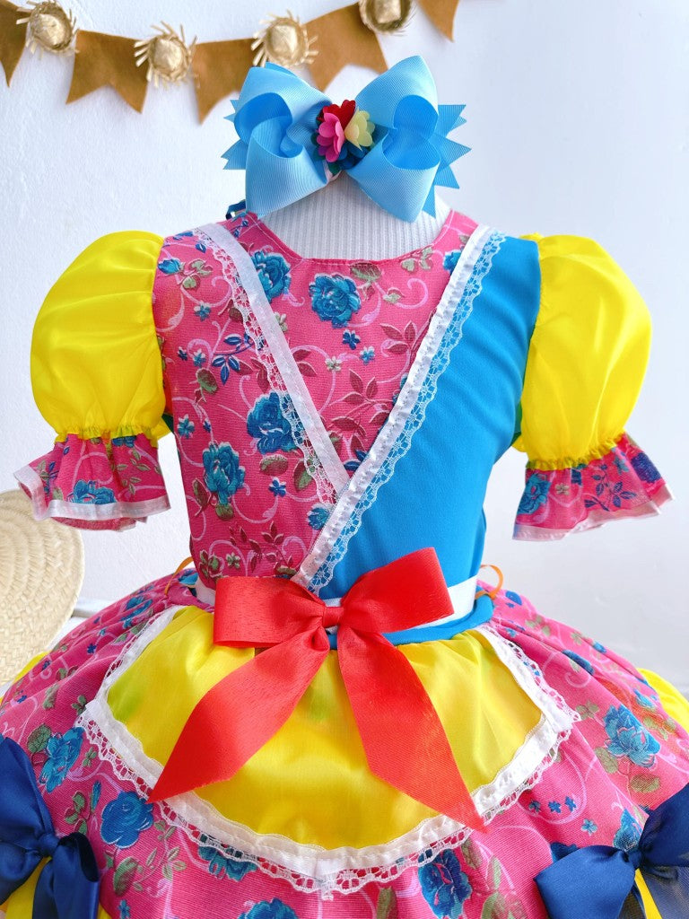 Vestido infantil de junio rosa y amarillo con flores de colores 