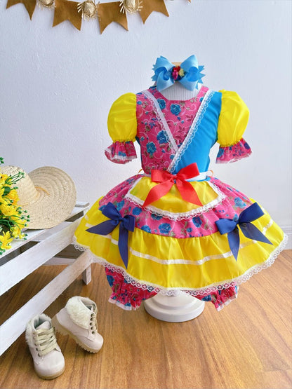 Vestido infantil de junio rosa y amarillo con flores de colores 