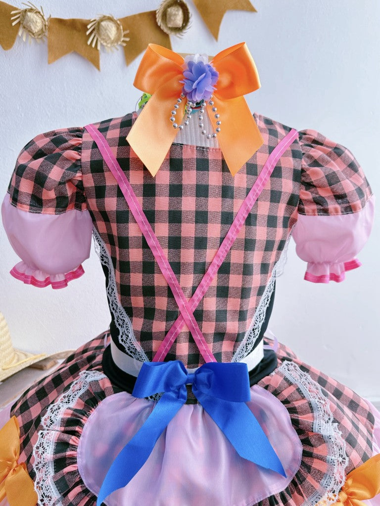 Disfraz infantil de junio en cuadros rosas y negros 