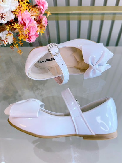 Zapato de lujo de charol blanco con aplique de lazo 