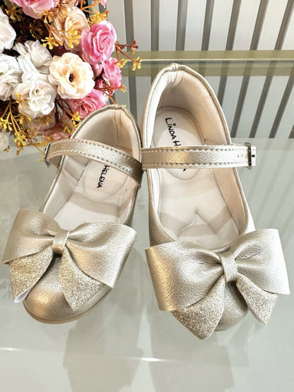 Zapato dorado mate con aplique de lazo de lujo