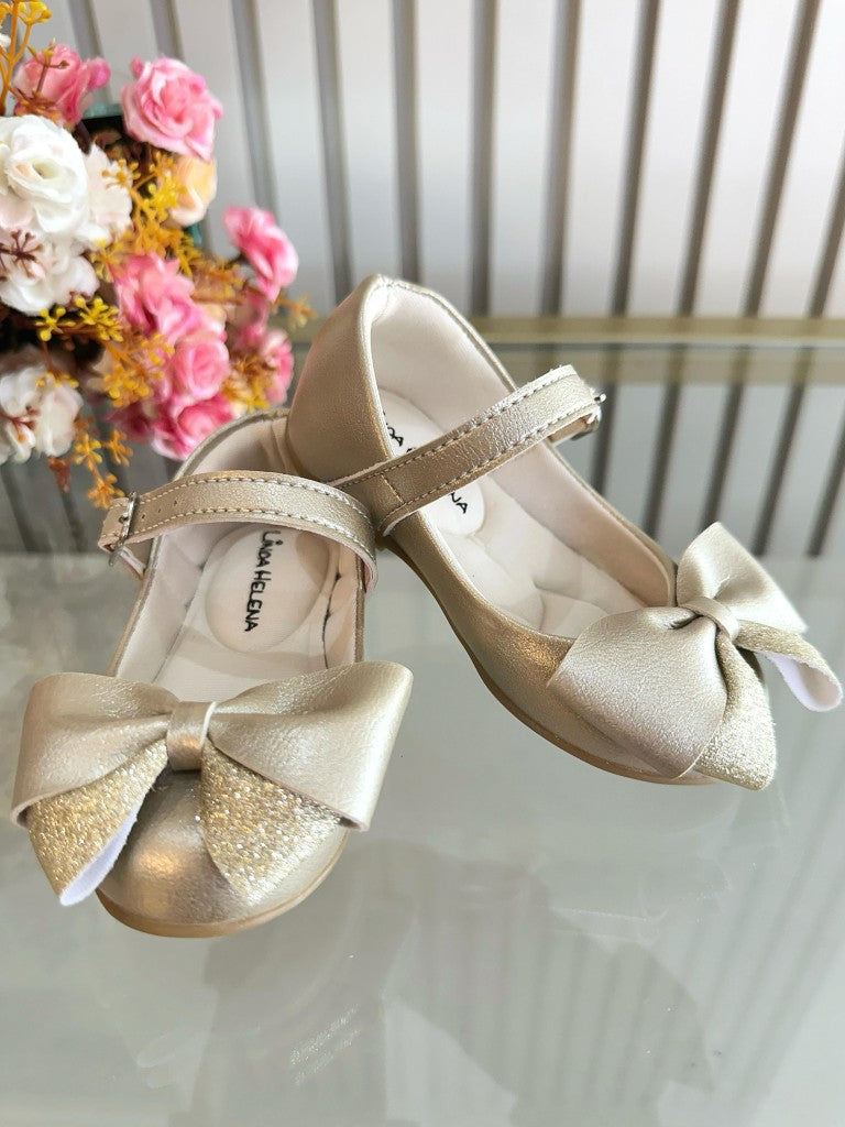 Zapato dorado mate con aplique de lazo de lujo
