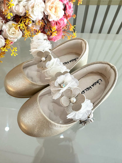 Zapatos infantiles dorados mate con apliques florales de lujo