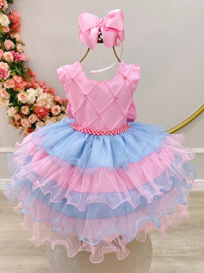 Vestido infantil rosa con busto acanalado y falda con volantes de colores
