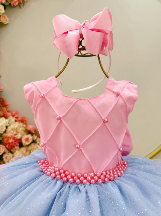 Vestido infantil rosa con busto acanalado y falda con volantes de colores
