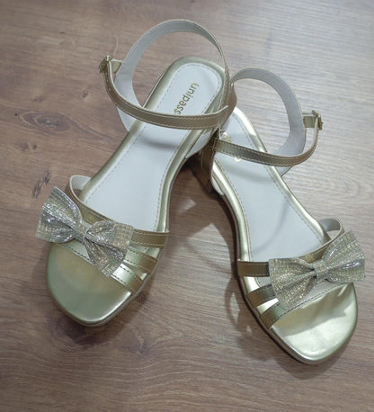 Sandalias de tiras doradas para niños con lazo y purpurina de lujo 